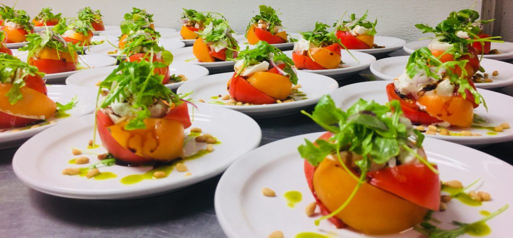 A table full of stuffed tomatos.