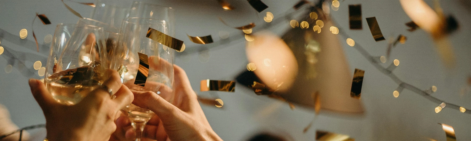 Experiences - Hands toasting at a celebration